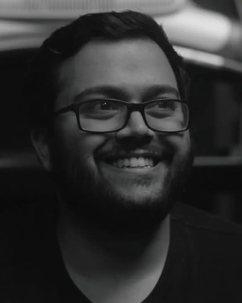 Kshitij Kapil in black and white, smiling